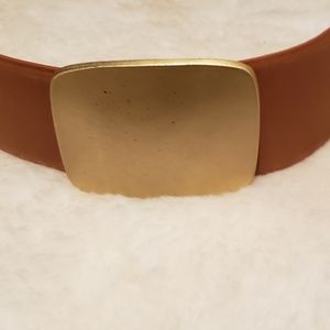 Donna Karan light brown waist belt. 3 Gold surrounding decorative metal buckles